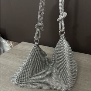 Gleaming Silver Mesh Shoulder Bag with Long Braided Handles